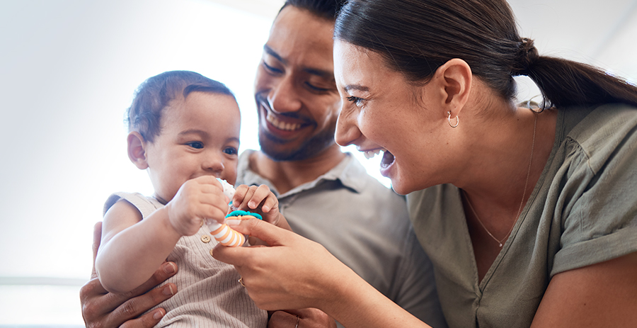 parents playing with their baby